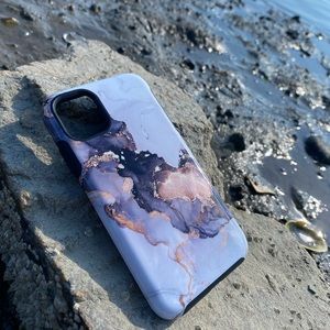 This is a marble glittery iPhone 11 phone case with extra protection built in 💗